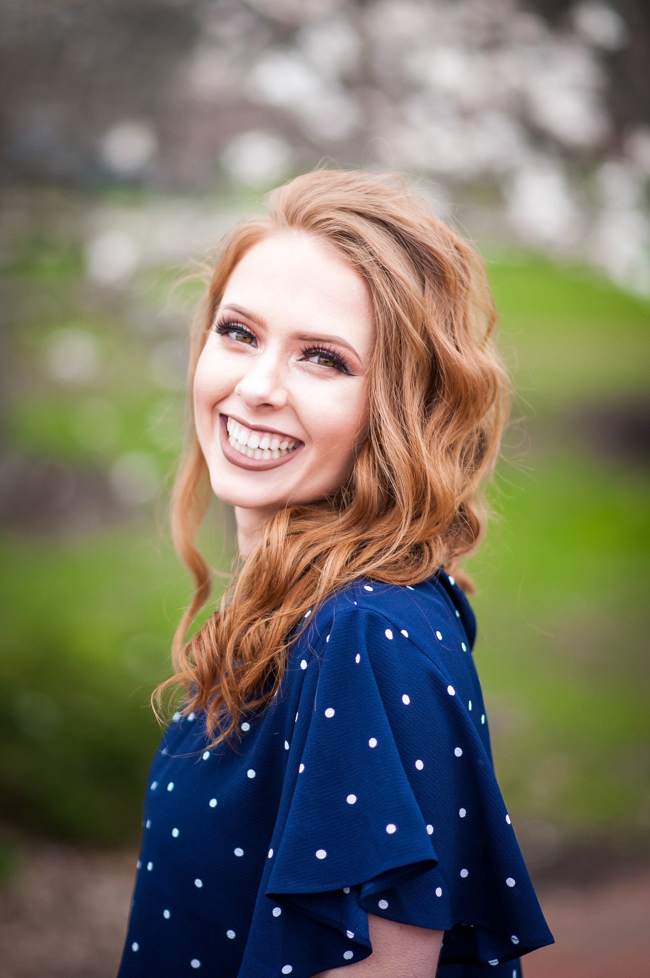 Luxury senior portrait — smiling redhead outdoors, Columbus Ohio senior photographer